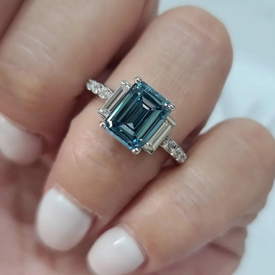/public/photos/live/Blue Emerald Cut Moissanite Three Stone Engagement Ring 610 (2).webp